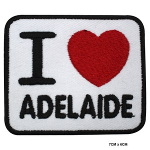 May include: White square patch with black embroidered text "I love Adelaide" and a red heart.