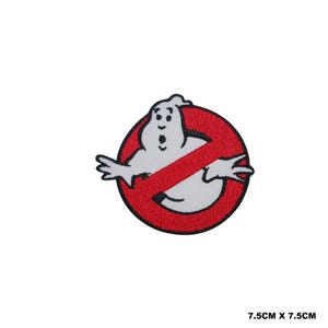 May include: A circular embroidered patch featuring a white ghost character centred within a red circle with a diagonal red slash across it, outlined in black. The patch measures 7.5 cm by 7.5 cm, which is approximately 2.95 inches by 2.95 inches.