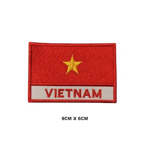 May include: Red embroidered patch with a yellow star and the word "VIETNAM" in white lettering. The patch measures 9 cm by 6 cm.