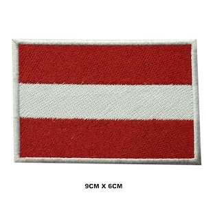 May include: Embroidered patch of the Latvian flag. The flag is red with a white stripe in the middle. The patch is 9 cm by 6 cm.