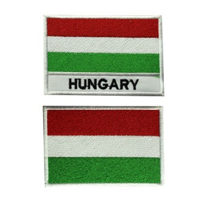 May include: Two embroidered patches featuring the Hungarian flag. The top patch has the flag with the word "HUNGARY" below it. The bottom patch is just the flag.