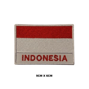 May include: Red and white embroidered patch with the word "INDONESIA" in red lettering. The patch is 9 cm by 6 cm.