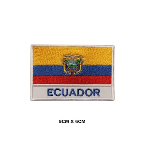 May include: Embroidered patch featuring the flag of Ecuador. The patch is yellow, blue, and red with the Ecuadorian coat of arms in the center. The words "ECUADOR" are written in white below the flag. The patch measures 9 cm by 6 cm.