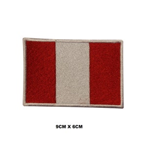 May include: Red and white embroidered patch of the flag of Peru. The patch is 9 cm by 6 cm.