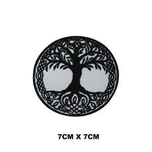 May include: Black embroidered iron-on patch of a tree of life design, 7cm by 7cm.