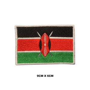 May include: Embroidered patch of the Kenyan flag. The flag is black, red, and green with a white shield and two spears in the centre. The patch is 9cm by 6cm.