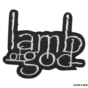 May include: A black embroidered patch featuring the white text Lamb of God in a stylised font. The patch measures 9.5 cm by 8 cm and has a die-cut border that follows the shape of the lettering, creating a distinct and bold visual design.
