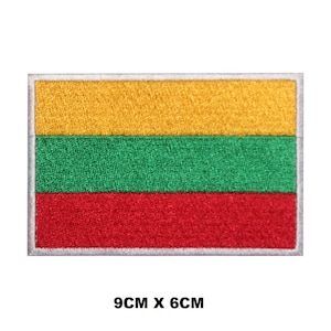 May include: An embroidered patch of the Lithuanian flag. The flag is yellow, green, and red with a white border. The patch is 9 inches by 6 inches.