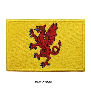 May include: A yellow embroidered patch with a red dragon, 9 cm by 6 cm.