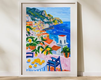 May include: A colorful painting of a seaside town with a lemon tree in the foreground. The town is built on a hillside and overlooks a blue sea. There are boats in the water and a white church with a bell tower. The painting is framed in white.