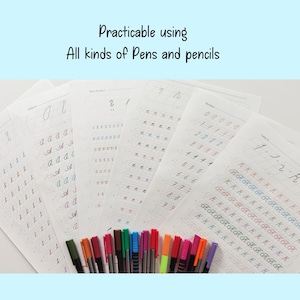 May include: A set of handwriting practice sheets with different letters and numbers. The sheets are printed on white paper and have a grid pattern. A variety of colored pens are laid out on the sheets.