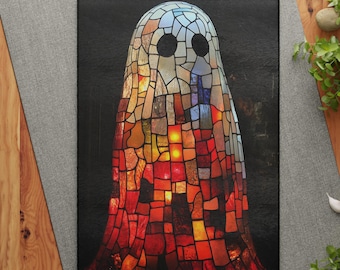 May include: A black cutting board featuring a stained-glass ghost design. The ghost is composed of various colored glass pieces, with a gradient of colors from red to blue. The board is rectangular and has a smooth surface.