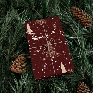 Burgundy Red Christmas Gift Wrapping Paper with Beige Design (Raindeers, Christmas trees, celestial design)