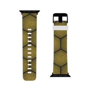 May include: A watch band with a geometric honeycomb pattern in shades of gold and black. The band is designed to fit a smartwatch and features a black buckle and connectors.