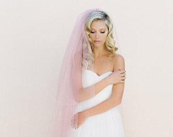 Single and double layer blush wedding veil to the fingertips from soft tulle raw cut edge with comb