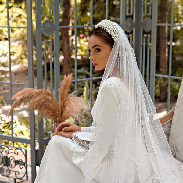 Pearl wedding veil in elegant soft tulle available in single and double tiers with a comb for attaching to the hair