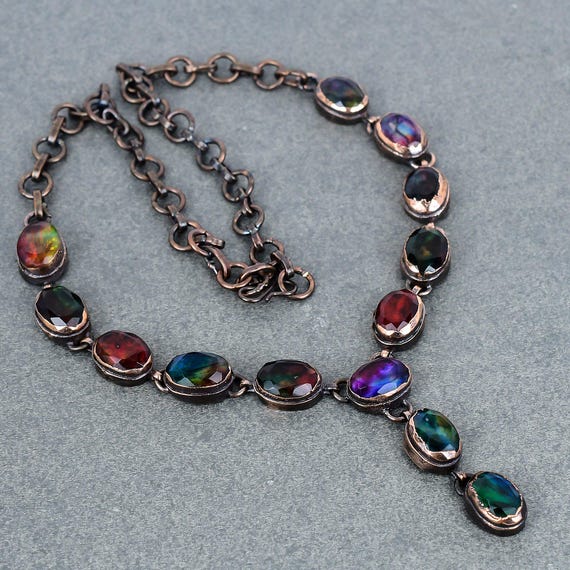 Electroforming copper directly onto a rare ammolite gemstone creates an organic, one-of-a-kind wearable that looks like it came from another world.