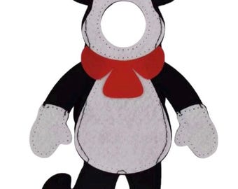 May include: A felt cutout of a character wearing a red and white striped hat, a red bow tie, and white mittens. The figure has a black body with a white chest and face area featuring a circular cutout for a face. The character has black ears and a tail.