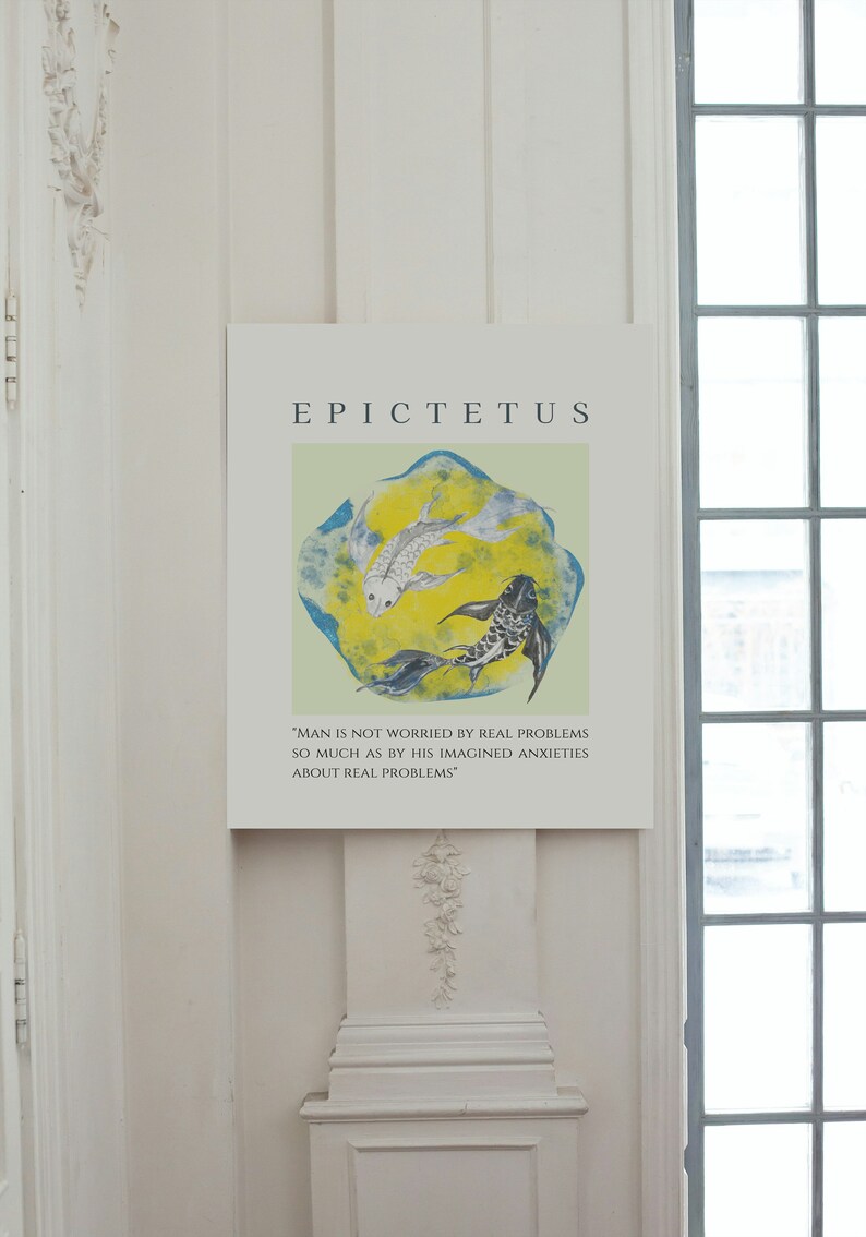 May include: A white and black print with a quote by Epictetus, "Man is not worried by real problems so much as by his imagined anxieties about real problems." The print features two fish swimming in a circle on a yellow and blue background.