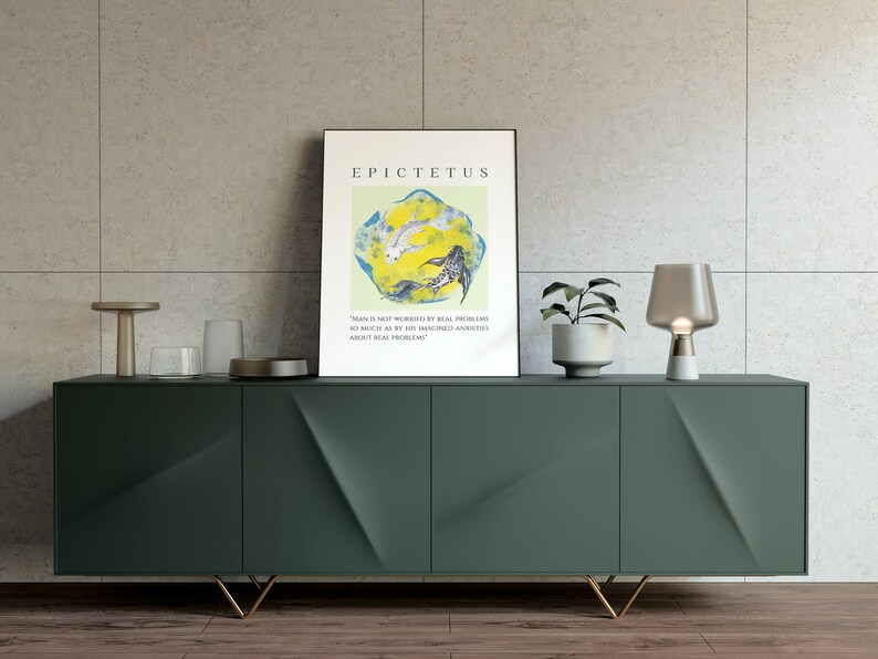 May include: A green cabinet with gold legs and a quote by Epictetus on a framed print above it. The quote reads "Man is not worried by real problems so much as by his imagined anxieties about real problems."