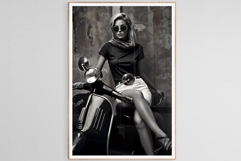 May include: A black and white photo of a woman wearing sunglasses and a scarf sitting on a vintage Vespa scooter.