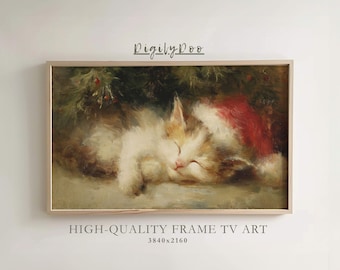 May include: A framed vintage-style painting of a sleeping kitten wearing a Santa hat. The cat has white, tan, and brown fur, with a red hat. The painting is labeled "DigilyDoo" and "HIGH-QUALITY FRAME TV ART".