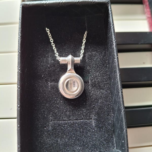 Flute key necklace, made from a recycled flute key, set on an 18 inch silver plated chain