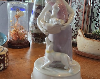 Musical box, Porcelain Lladro Style Figurine Girl Carrying Basket of Puppies