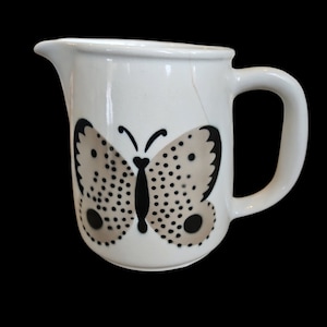 Arabia Finland  pitcher 5.5 inches tall with double sided hand painted butterflies