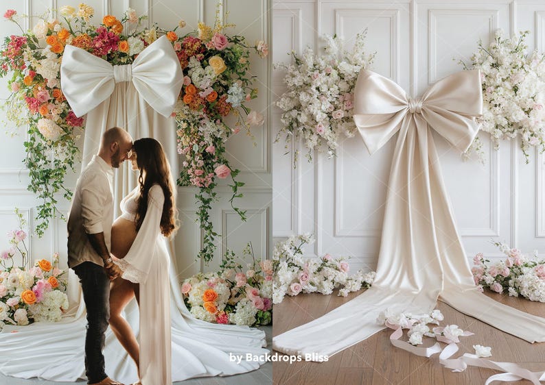 May include: A white backdrop with a large white satin bow and floral arrangements on either side. A couple are standing in front of the backdrop, the woman is pregnant.