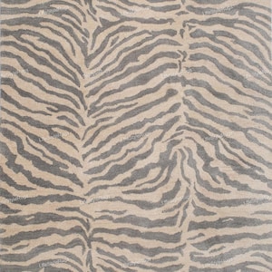 May include: A rectangular rug with a zebra stripe pattern. The rug features alternating stripes of gray and beige, creating a bold and eye-catching design. The rug is suitable for living rooms and bedrooms.