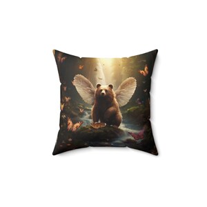 May include: A brown bear with white wings sits in a forest setting with a waterfall in the background. The bear is surrounded by butterflies in various colors.