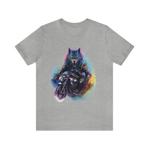 May include: A gray t-shirt with a colorful graphic of a wolf riding a motorcycle. The wolf has blue fur and is wearing a leather jacket. The motorcycle is black and has a yellow headlight.