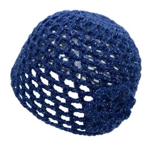 May include: A navy blue crocheted hat with a silver metallic thread woven throughout. The hat has an open weave design and a small flower detail on the side. The hat is shown against a white background.