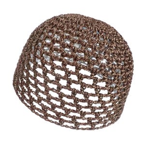May include: A brown crocheted hat with a net-like design. The hat is made of a shiny, metallic-looking yarn and has a rounded shape. The open weave allows light to pass through, creating a see-through effect. The hat is likely handmade.