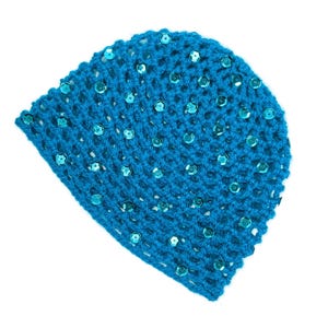 May include: A turquoise crocheted beanie hat with scattered, iridescent sequins. The hat is made of a loosely woven, open-stitch pattern, allowing glimpses of the background. The sequins add a touch of sparkle to the handmade accessory.