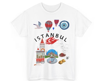 Puede incluir: Camiseta blanca con una colorida ilustración de Estambul. El diseño incluye globos aerostáticos, una gaviota, la bandera turca y la palabra "Estambul", junto con otros símbolos culturales.