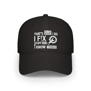 May include: Black baseball cap with white embroidery that reads "That's what I do I fix stuff and I know things". The embroidery also includes a wrench and a toolbox.