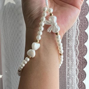 Correa de muñeca con cuentas de perla, correa de teléfono con cuentas de perla, correa para billetera, correa para cámara, correa de muñeca ligera, dije de corazón, cinta, ideas de regalo