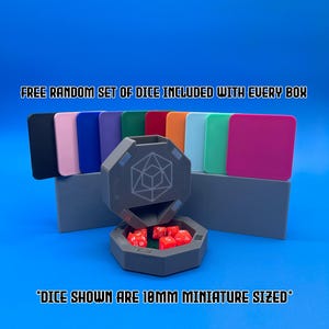 May include: A grey, octagonal dice tower with a lid that opens to reveal a compartment for dice. The tower is surrounded by a variety of coloured plastic trays. The text "FREE RANDOM SET OF DICE INCLUDED WITH EVERY BOX" is displayed above the tower. The text "*DICE SHOWN ARE 18MM MINIATURE SIZED*" is displayed below the tower.