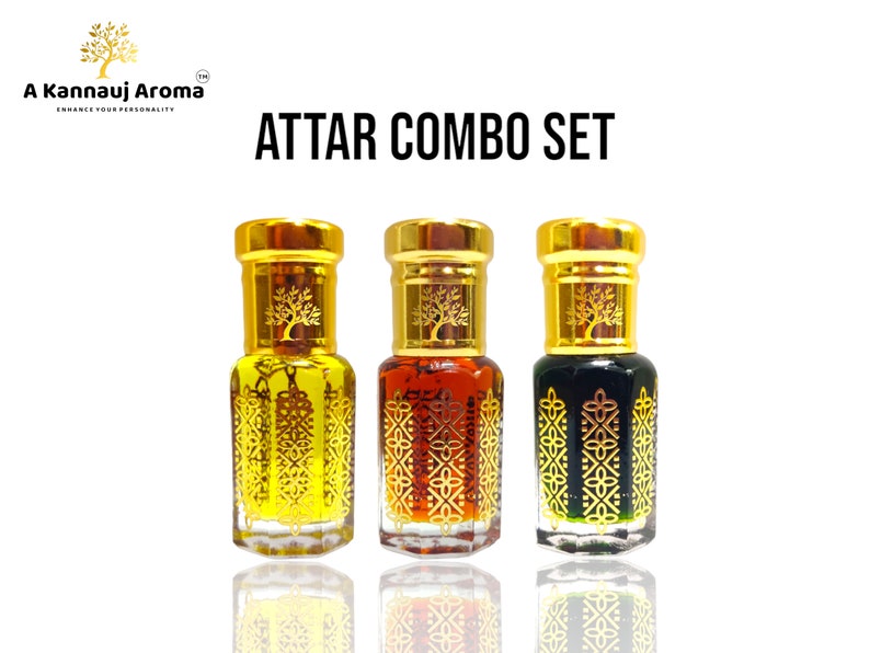 May include: A set of three small glass bottles with gold lids and intricate designs. The bottles contain a dark liquid and are labeled "ATTAR COMBO SET".