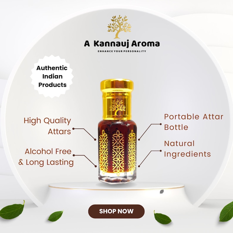 May include: A gold bottle containing a brown liquid, labelled "A Kannauj Aroma Enhance Your Personality". The bottle is on a white surface with green leaves. The text "Authentic Indian Products", "High Quality Attars", "Alcohol Free & Long Lasting", "Portable Attar Bottle", "Natural Ingredients", and "Shop Now" are also visible.