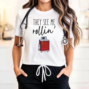 Funny Nurse T-Shirt: "They See Me Rollin'" Crash Cart Tee