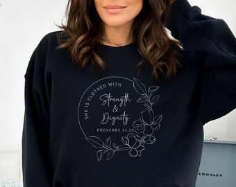 May include: Black sweatshirt with a white circle graphic that says "She is clothed with strength & dignity, Proverbs 31:25".