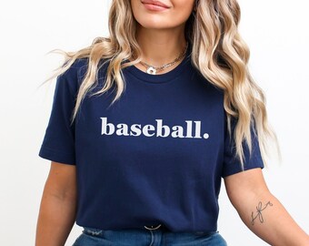 May include: A navy blue t-shirt with the word "baseball." printed in white on the front.