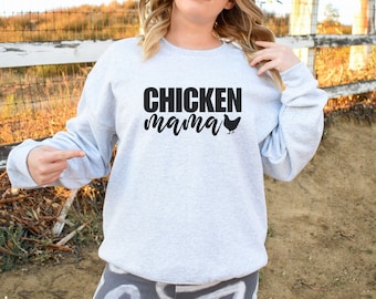 May include: A gray sweatshirt with the text "CHICKEN mama" and a black silhouette of a chicken on the front.