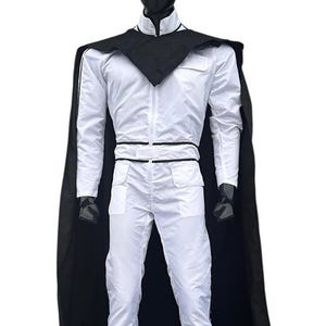 May include: A white jumpsuit with a black cape and collar is displayed on a mannequin. The jumpsuit has a zip-up front, pockets, and black trim. The black cape drapes over the shoulders, creating a striking contrast.