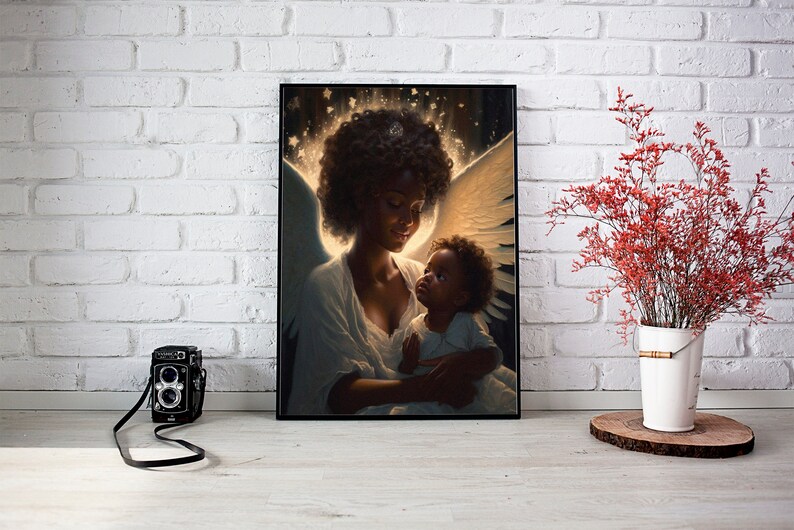May include: A painting of a Black woman with angel wings holding a Black baby. The woman is wearing a white dress and the baby is wearing a white shirt. The background is a soft glow of light.