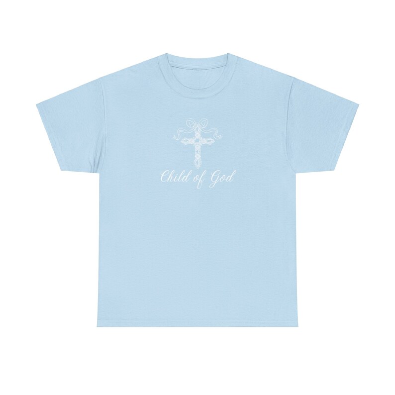 May include: Light blue t-shirt with a white cross design and the text "Child of God" printed on the front.