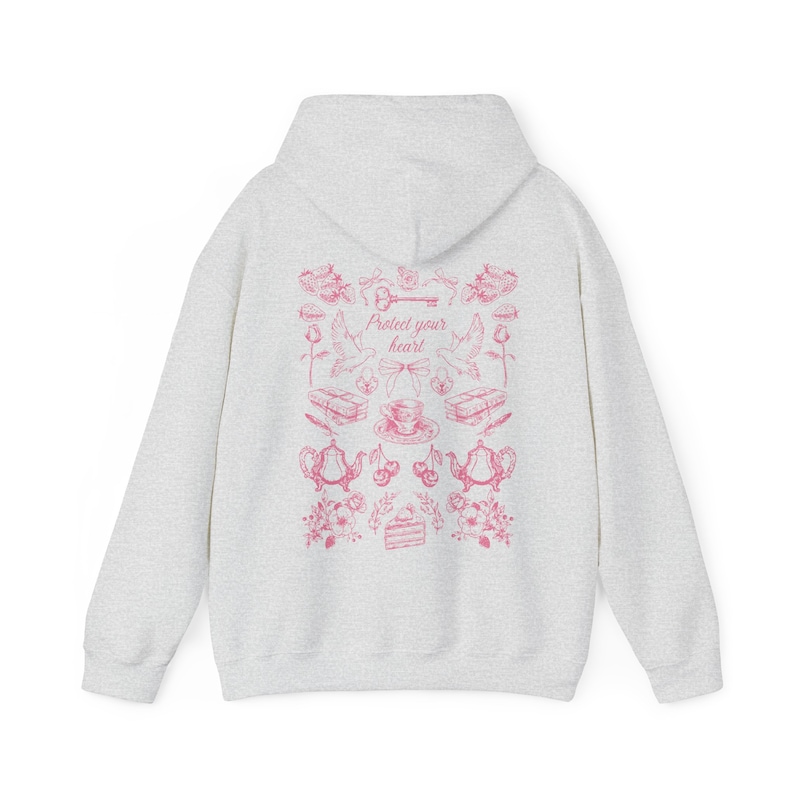 May include: A gray hooded sweatshirt with a pink graphic print on the back. The graphic features a key, birds, teacups, and the text "Protect your heart!"